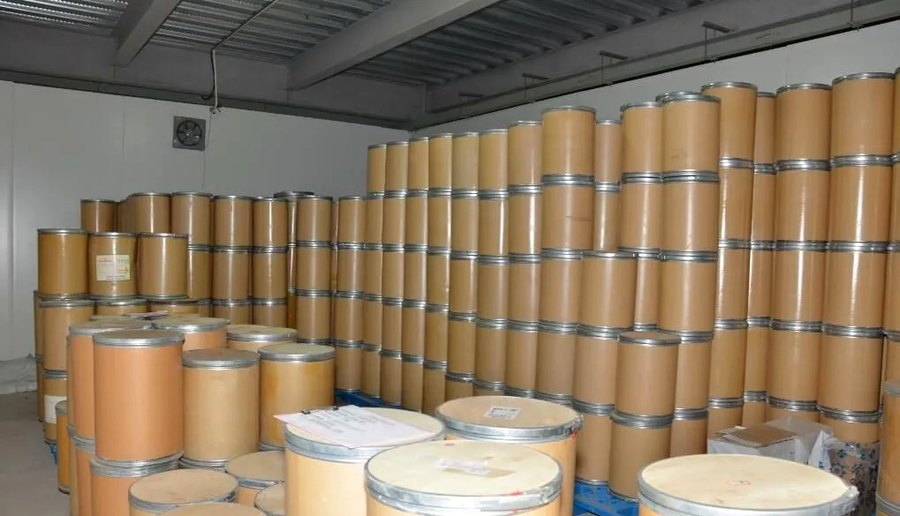 Finished-goods warehouse with labelled export drums